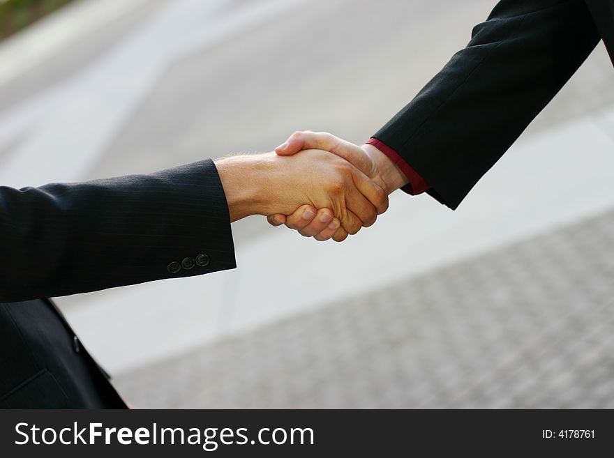 Close up of handshake between two businessmen. Close up of handshake between two businessmen