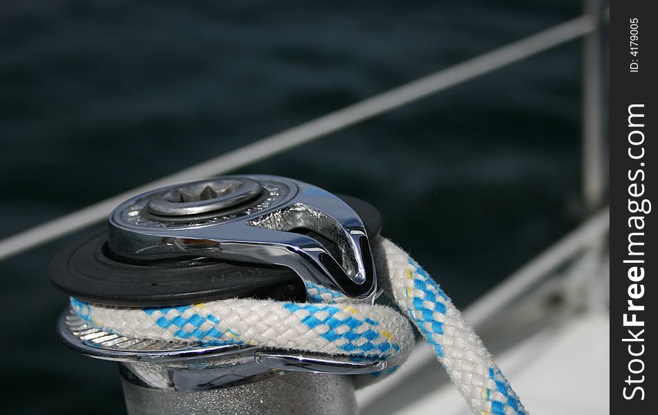 Stainless steel winch and sheet with sea background