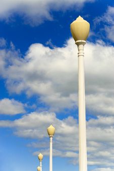 Lamp Posts With Cloudy Sky Stock Photo