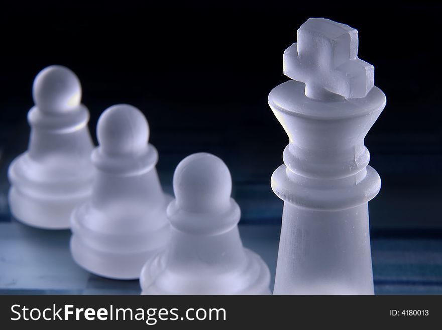 Chess pawns and a King in line. Chess pawns and a King in line.