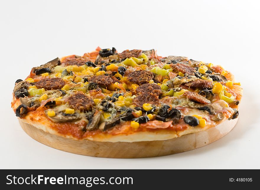Isolated homemade pizza on white background.