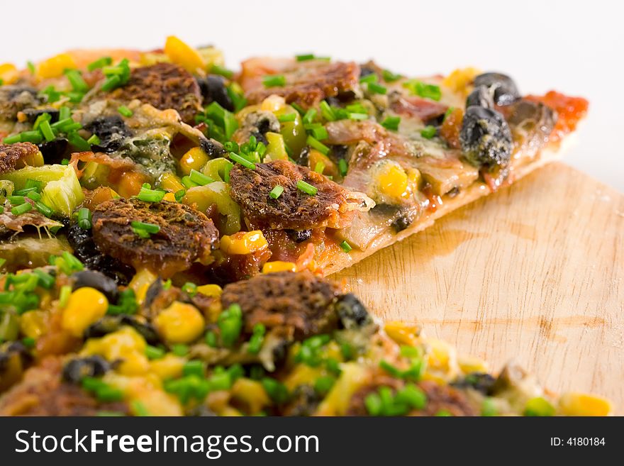 Closeup homemade pizza slices on white background.