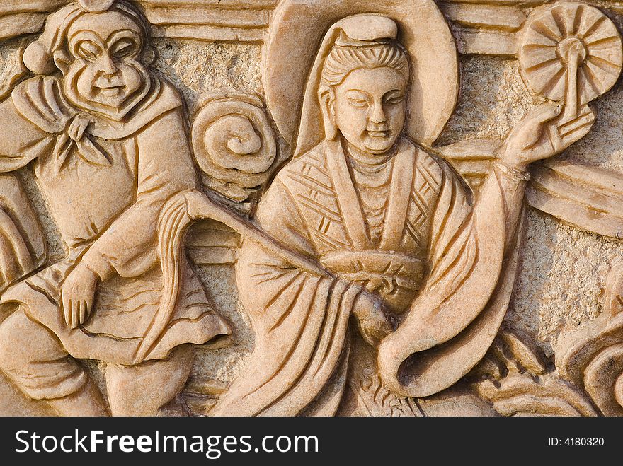 It is a story about buddhism on stone by artificial carving . It is a story about buddhism on stone by artificial carving .