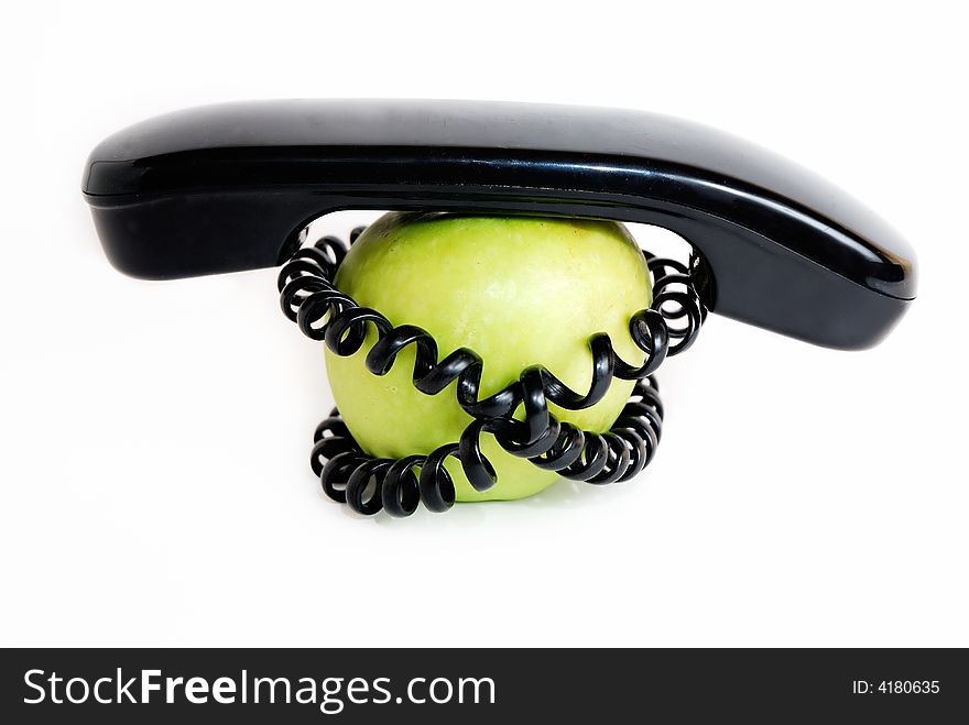 Green apple with handset and connected wire