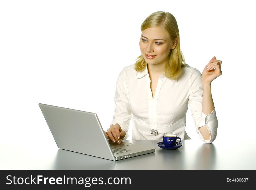 Beautiful girl working in the office, with cup of coffee