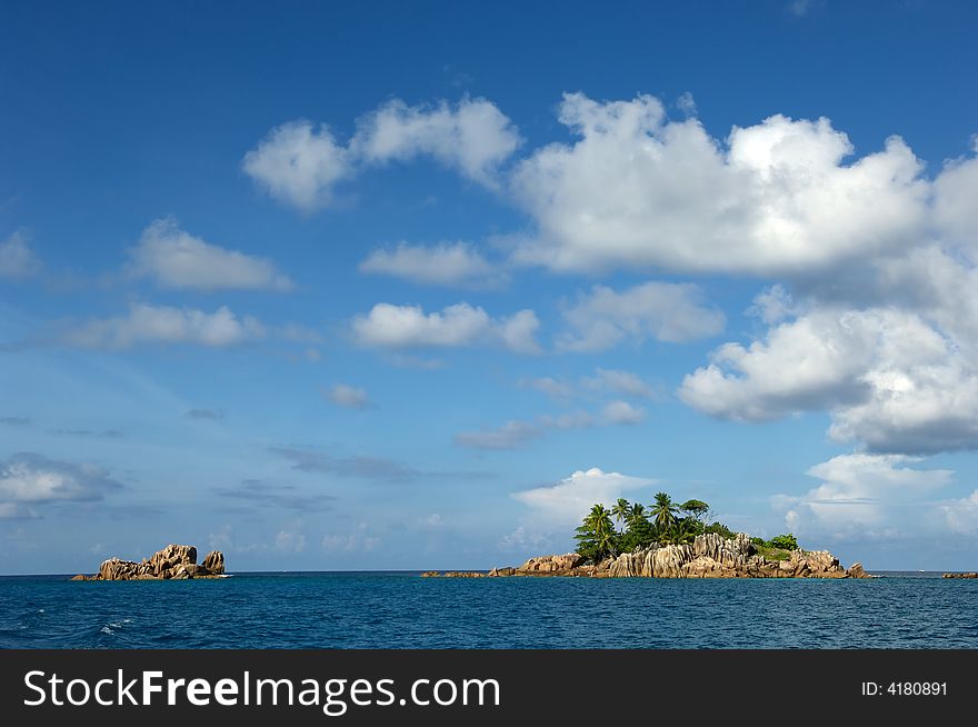 Island at the Indian ocean with coconut palm trees