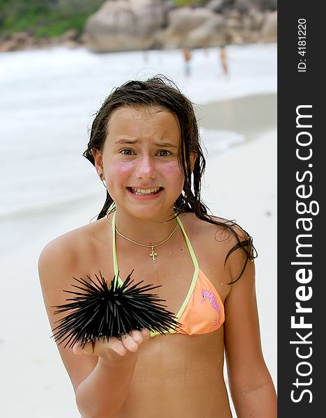 The girl for the first time holds a sea hedgehog