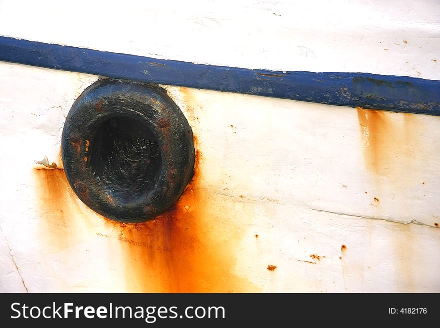 Rusty blue and white part of boat