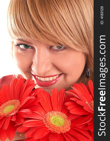 A smiling blonde with red flowers