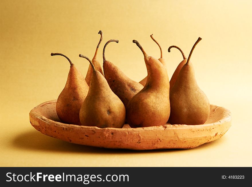Pears in a plate on a table