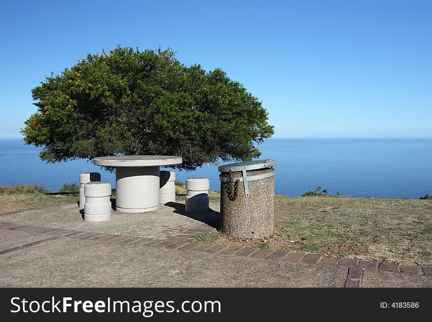 Isolated picnic area with tree overlooking the ocean