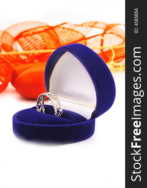 Wedding ring and red background