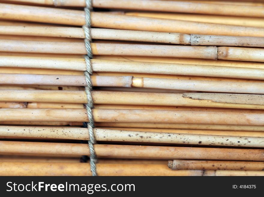 Bamboo background with tied rope
