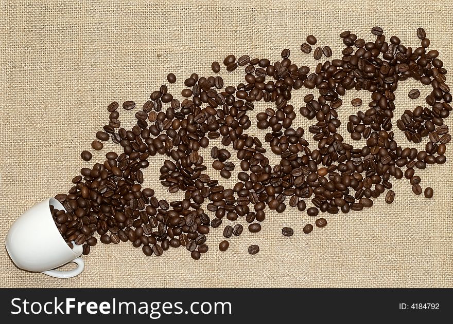 Grains of coffee on a tissue background