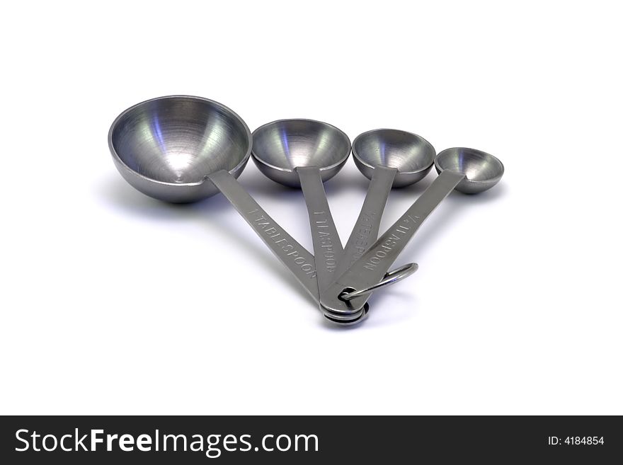 Measuring spoons on a white background.
