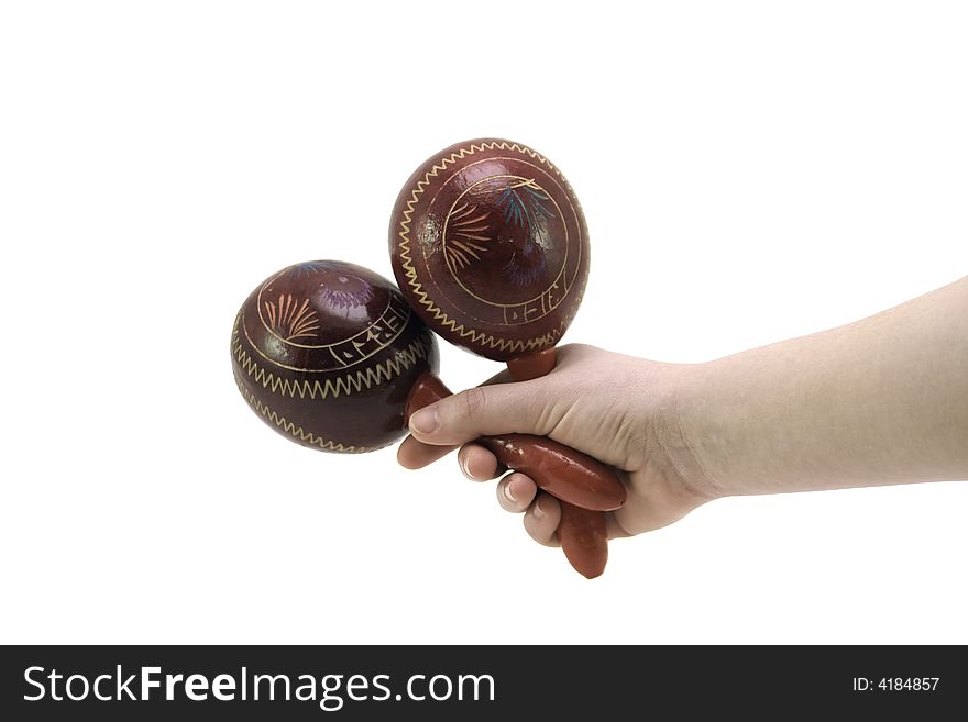 A pair of maracas held by a model against a white background.