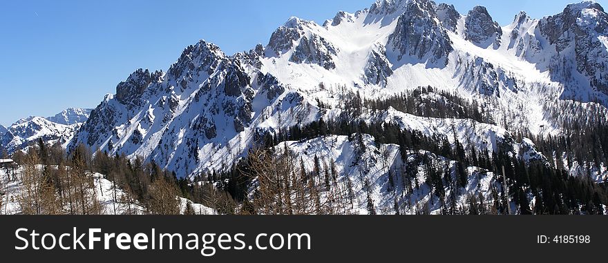 Alpine peaks in winter, panorama; Cima del cacciatore in Italy. Alpine peaks in winter, panorama; Cima del cacciatore in Italy