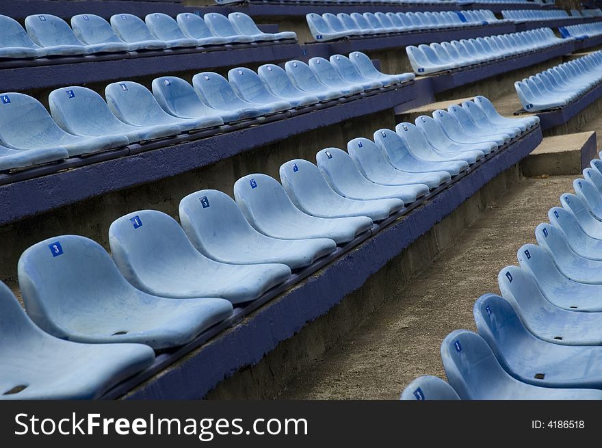 Blue empty stadium seats. abstract. Blue empty stadium seats. abstract