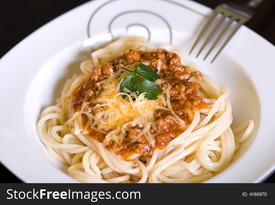 Spaghetti and wine on dark table. Spaghetti and wine on dark table