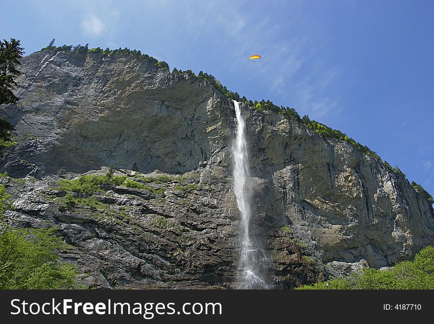 Swiss waterfall, paragliding