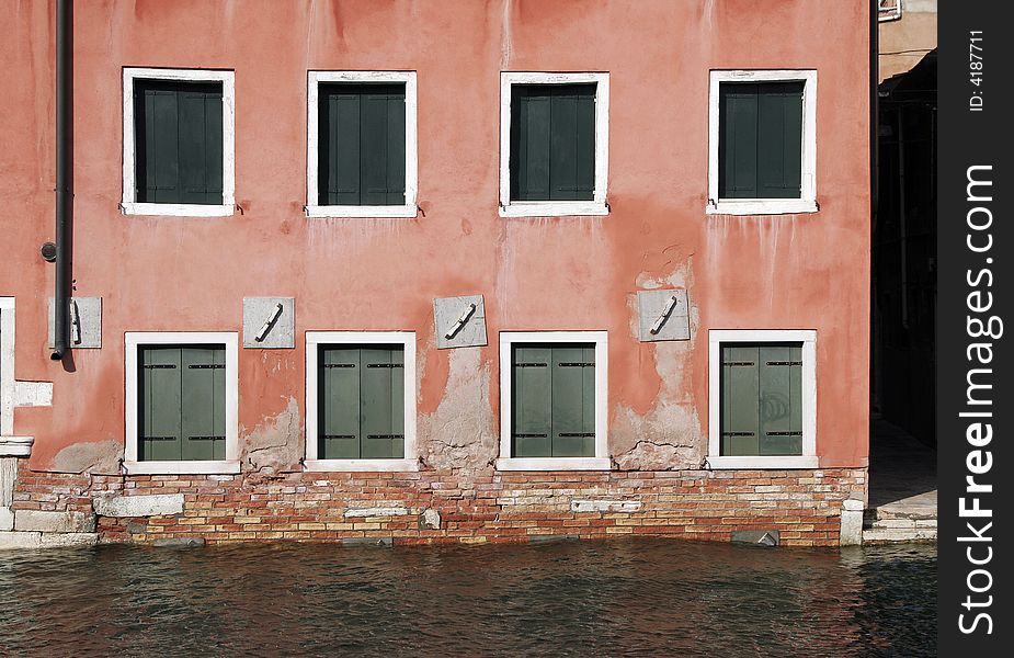 Venice, Windows - Typical Old Building Water Front Facade And Canal, Italy. Venice, Windows - Typical Old Building Water Front Facade And Canal, Italy