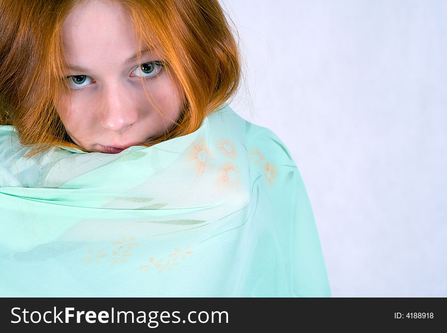 Portrait of  innocent looking young woman with a veil.