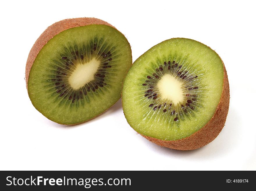 Kiwi that has been cut in half over white background. Kiwi that has been cut in half over white background