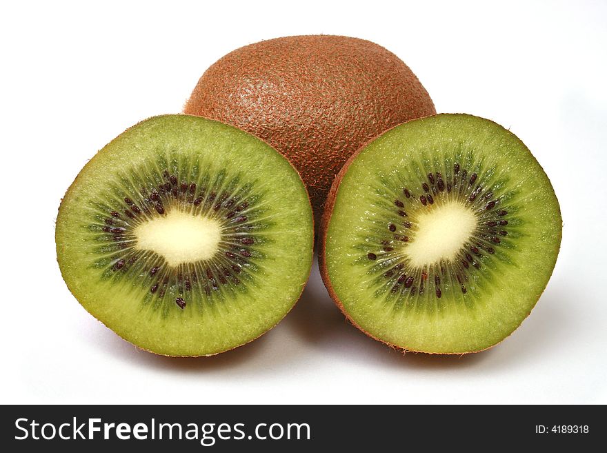 Kiwi that has been cut in half over white background. Kiwi that has been cut in half over white background