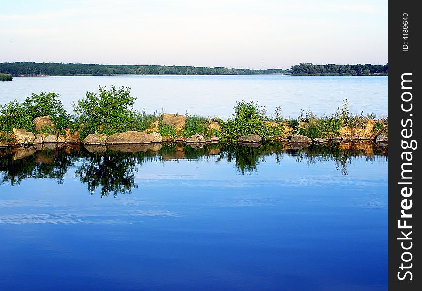 Calm Lake Blue Waters with the Path of Stones