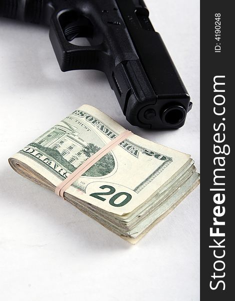 A semi-automatic pistol and some money. A semi-automatic pistol and some money