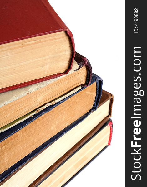 Stack of old books on white background