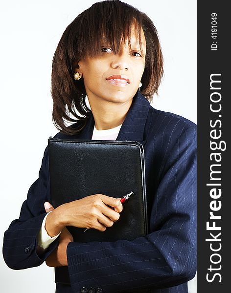 Business woman with portfolio and red pen in the hands. Business woman with portfolio and red pen in the hands