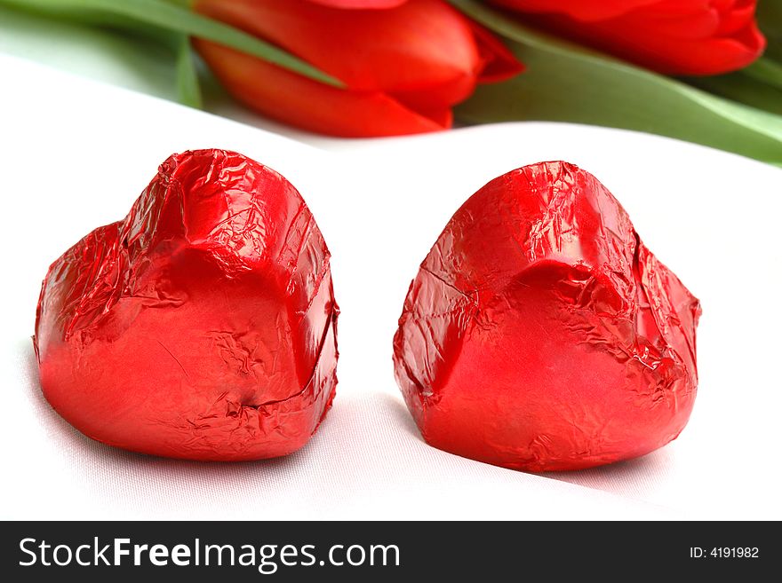 Chocolates for Valentine day and red tulips