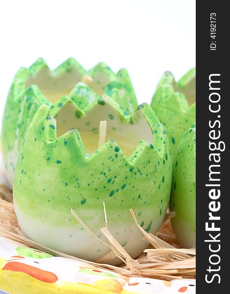 Easter candles- green eggs on a plate. Easter candles- green eggs on a plate