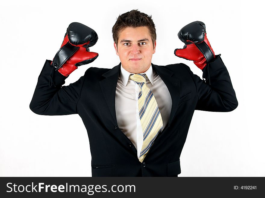 Businessman over white boxing in suit with red gloves. Businessman over white boxing in suit with red gloves