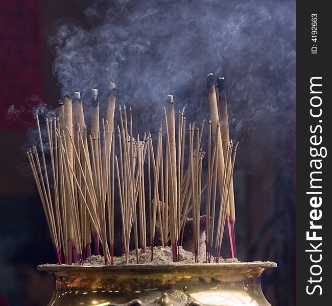 Burned joss sticks inside Chinese Temple