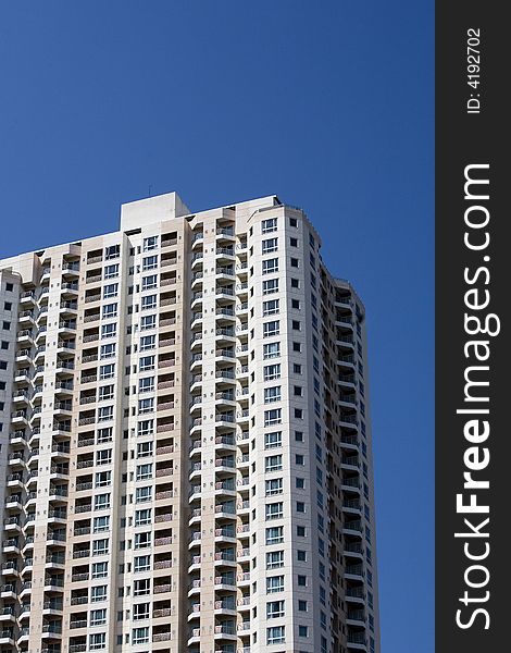 Apartment building against blue sky