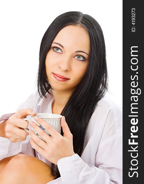 Woman in man shirt with cup of coffee