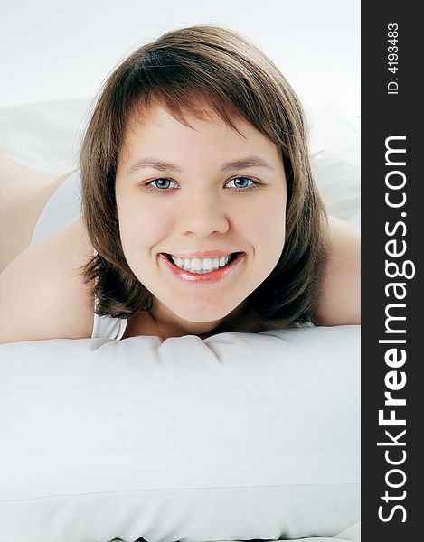 Young smiling woman lie in bed. Young smiling woman lie in bed