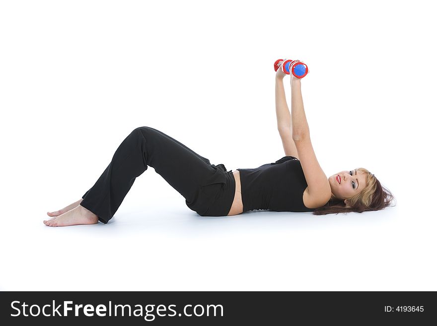 Beautiful girl with dumbbells on  isolated background