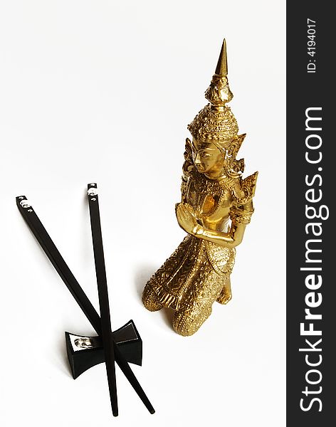 Golden Budda And Chopsticks