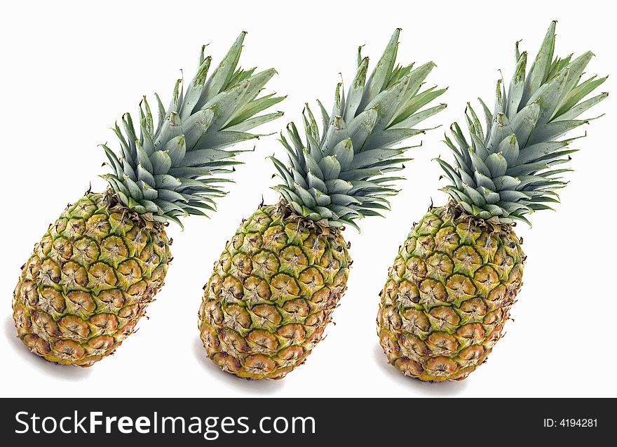 Three Pineapples Isolated on White Background.