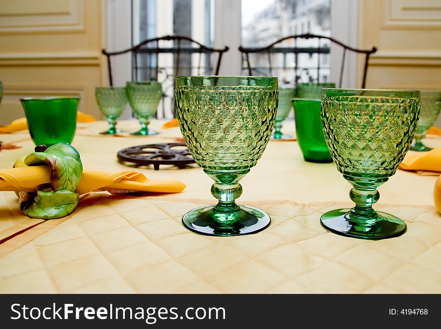 Green glasses on a table
