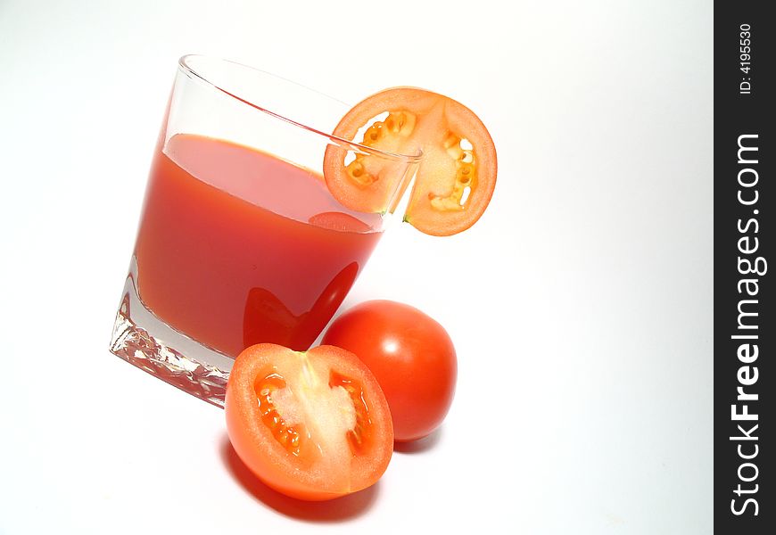 Still life with tomatos juice and tomatos