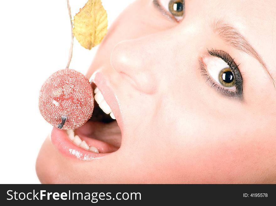 Cute woman eating small apple over white. Cute woman eating small apple over white