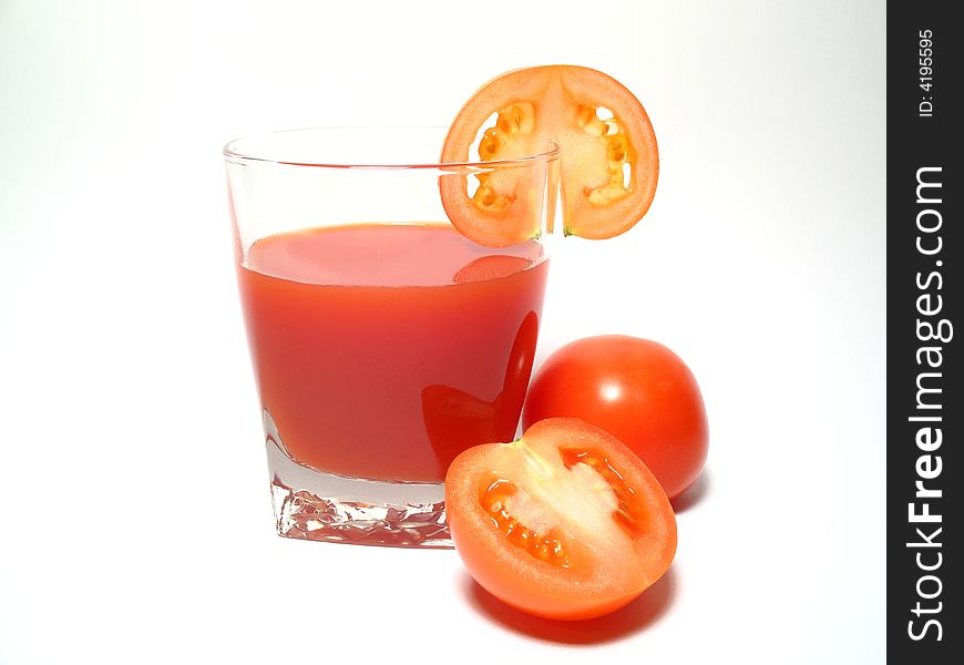 Still life with tomatos juice and tomatos