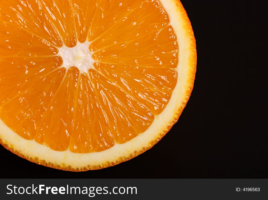 Fresh orange isolated on black