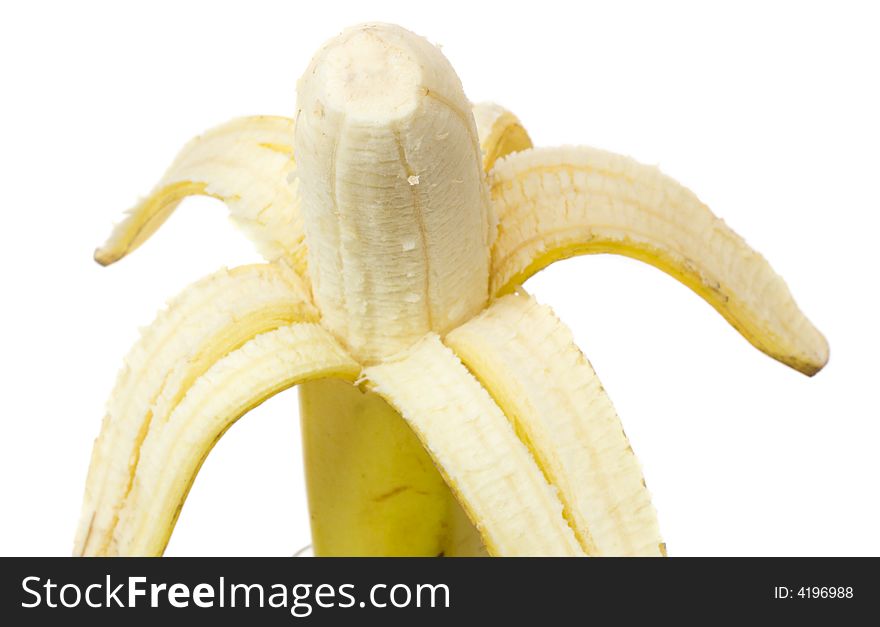 Close-up half peeled banana, isolated on white