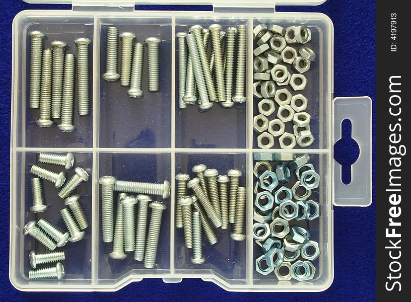 Organizer with several nuts and screws of different sizes. Organizer with several nuts and screws of different sizes