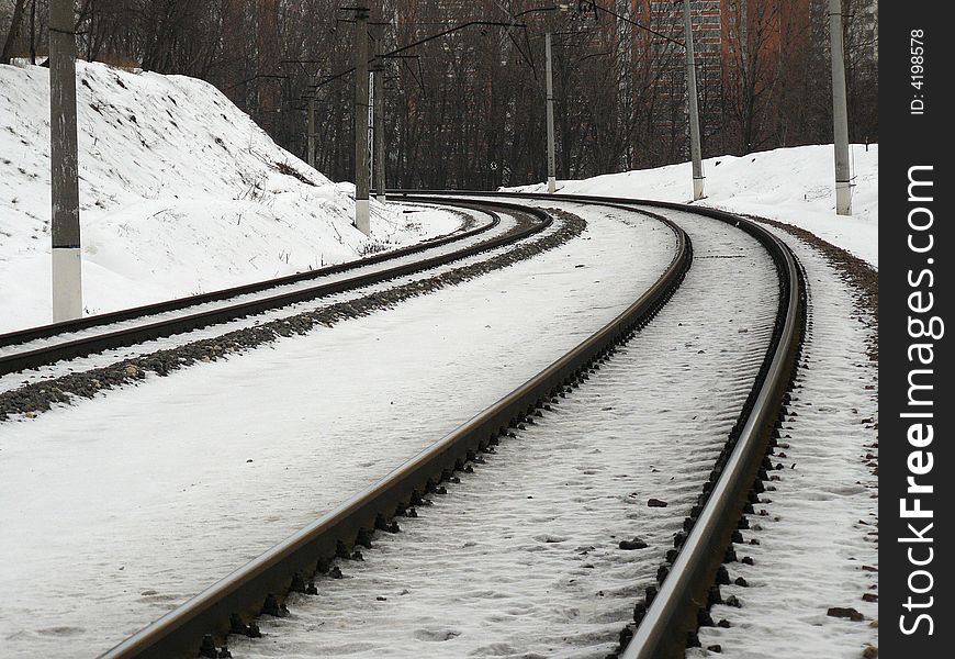On a background of a snow the railway leaves afar for turn
